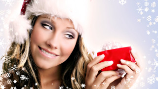 Santa hat woman holding gift - present free wallpaper
