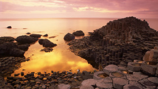 Rocky beach sunset cityscape water - beautiful landscape free wallpaper