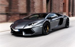 Silver sports car driving brick - matte finish free wallpaper for desktop