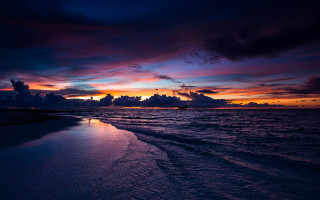 Sunset beach boat clouds water - a boat in the distance free wallpaper