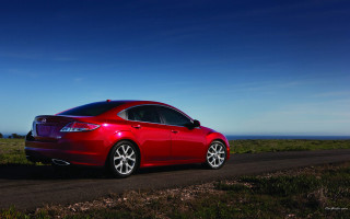 Red car ocean grass sunny - near free wallpaper for desktop