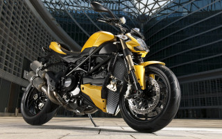 Yellow motorcycle building sky glass - a yellow motorcycle free wallpaper