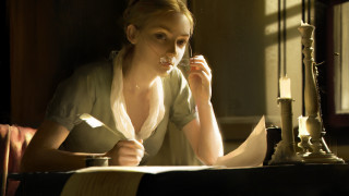 Woman sitting candle book window - her hand and a book in her other hand free wallpaper