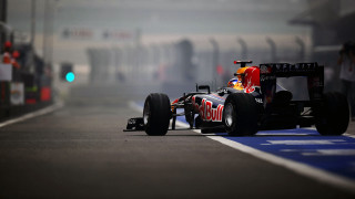 Red bull racing car foggy 2 - a green light in the background free wallpaper