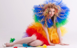 Colorful dress feathered hat sitting - colour free wallpaper