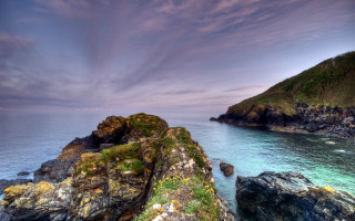 Rocky cliff green island cloudy - a rocky cliff free wallpaper