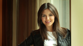 Woman smiling doorway black jacket - free portrait wallpaper