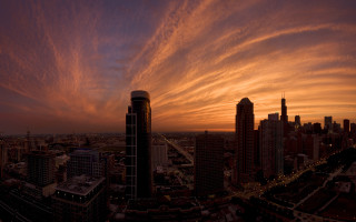 City skyline sunset clouds mountains - a few building free wallpaper