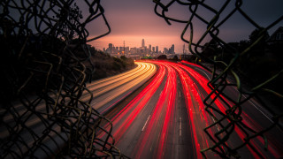City skyline fence light streaks - a long exposure free wallpaper