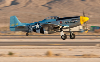 Blue yellow airplane desert mountains - airplane free wallpaper