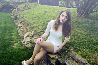 Woman sitting field fence shed - pale free wallpaper