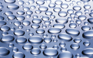 Water droplets blue surface macro 5 - a surface of water free wallpaper