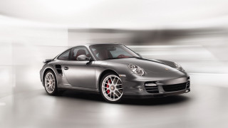 Silver sports car driving white - a white wall behind free wallpaper