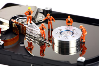Hard drive small people standing - a hard drive free wallpaper