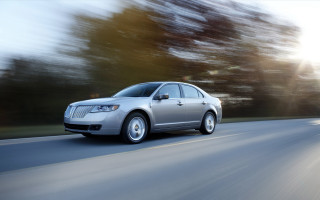 Silver car driving road trees - a silver car free wallpaper