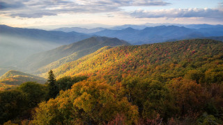 Mountain range forest lake sunset 4 - a view of a mountain range free wallpaper