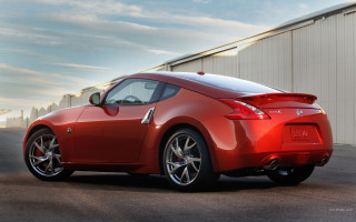 Red sports car building clouds 3 - rim free wallpaper