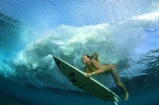Woman surfing underwave ocean bikini - in the ocean free wallpaper