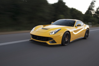 Yellow sports car driving road 6 - a blurry background free wallpaper