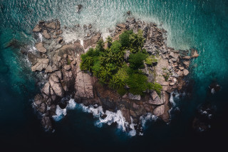 Aerial rocky island tree water - an aerial view free wallpaper