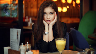 Woman sitting table orange juice 2 - a glass free wallpaper