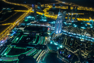 Cityscape clocktower neonlights tiltshift night - aerial free wallpaper