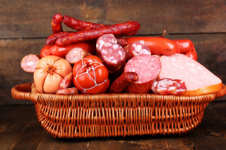 Basket sausages tomatoes wooden table - a wooden background free wallpaper