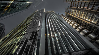 Tall building night windows cityscape - a sky line in the background free wallpaper