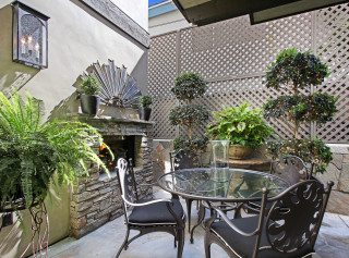 Patio table chairs fireplace overgrown - a fire place free wallpaper