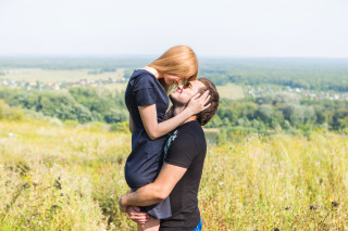 Romantic couple kissing field nature - tall grass and trees free wallpaper