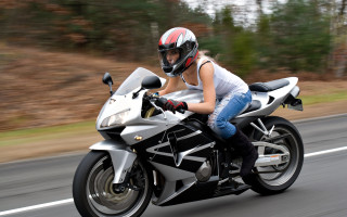 Woman motorcycle forest street motionblur - a forest free wallpaper