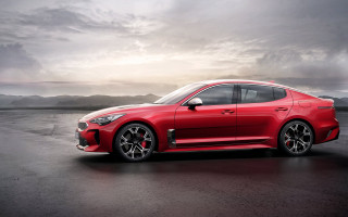 Red sports car wet road - a wet road free wallpaper