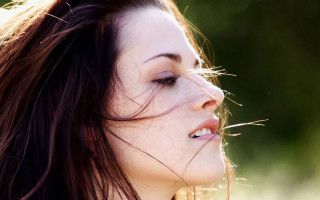 Woman blowing hair closed eyes - the wind free wallpaper