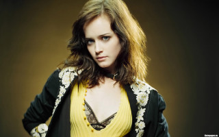 Woman yellow top black jacket - long dark hair free wallpaper