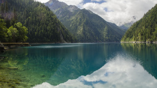 Lake mountains trees clouds sky 5 - the water below free wallpaper