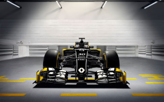 Yellow black race car garage - a white wall behind free wallpaper