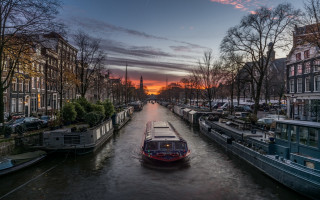 Cityscape boat sunset tower tiltshift - tall building and a clock tower free wallpaper