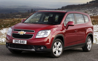 Red chevrolet suv mountain road 2 - a road near a mountain range free wallpaper