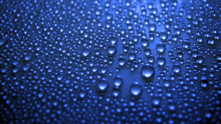 Water droplets blue surface fence - a close up of water droplets free wallpaper
