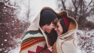 Man woman blanket snow smiling - a photo free wallpaper