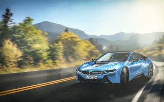 Blue car forest mountains sun - a road next free wallpaper