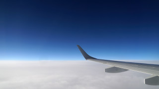 Airplane wing clouds blue sky - a view of the wing free wallpaper