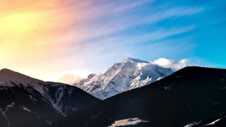 Mountain range snowy peak sunrise - mountain in the background free wallpaper