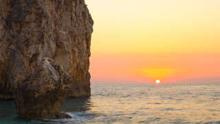Ocean sunset rock boat magicrealism - a large rock free wallpaper