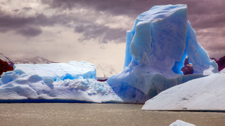 Iceberg mountain beach sunset ocean - the water near a mountain range free wallpaper