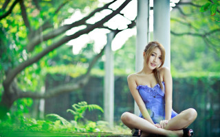 Woman blue dress park blonde - tree and bushes behind her free wallpaper