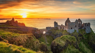 Castle cliff ocean sunset sky 2 - a sunset over the ocean free wallpaper