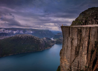 Cliff overlooking mountains water sky - a body of water and mountains free wallpaper
