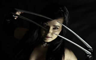Woman holding two knives overhead - the other hand free wallpaper
