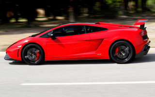Red sports car street forest 2 - a forest of trees and bushes free wallpaper